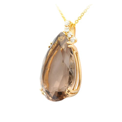 Yellow gold, quartz, and diamonds
