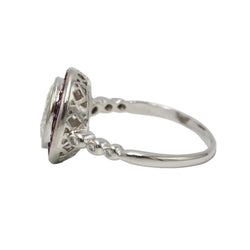Entourage Ring in platinum, rubies, and diamonds