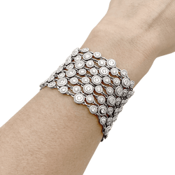 Bracelet souple, or blanc et diamants.