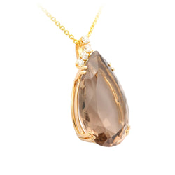 Yellow gold, quartz, and diamonds
