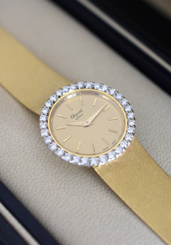 CHOPARD watch, Ref. 810, 18-carat yellow gold and diamonds, solid gold integrated bracelet, circa 1980.
