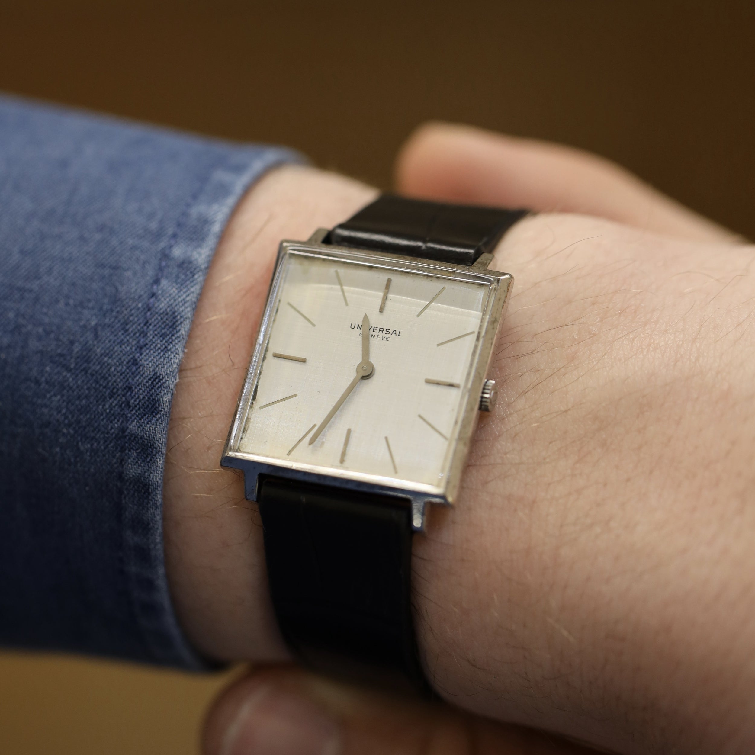 UNIVERSAL GENÈVE watch in steel and leather