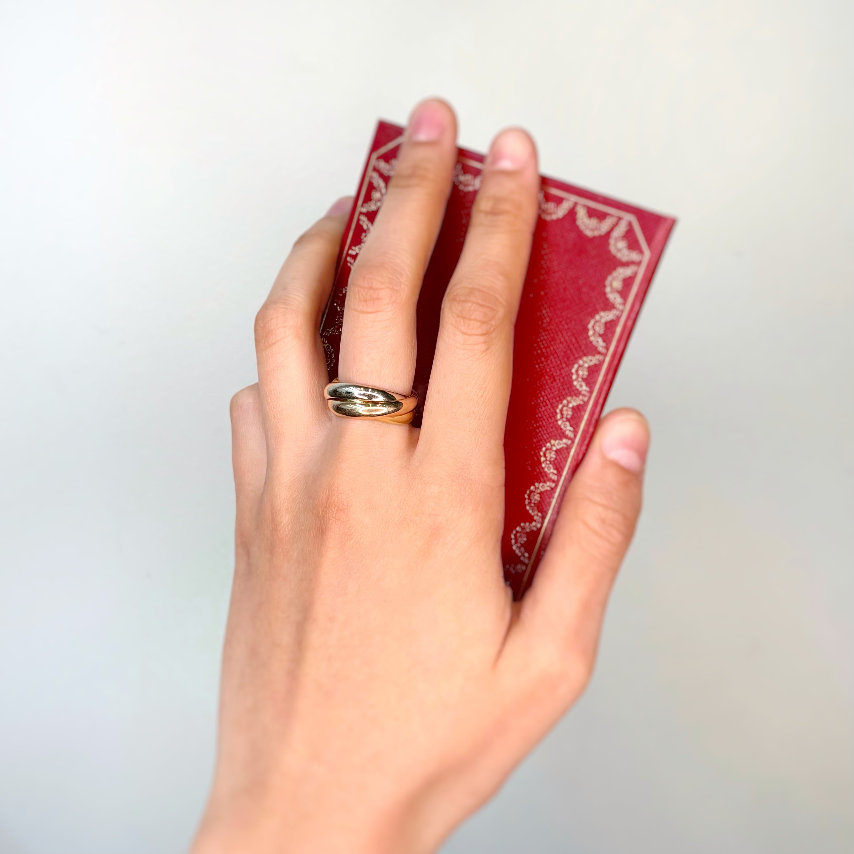 Bague Alliance CARTIER Trinity en or jaune, or blanc, et or rose