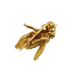 Yellow gold and emerald brooch pin