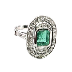"Entourage" Ring in White Gold, Emerald, and Diamonds