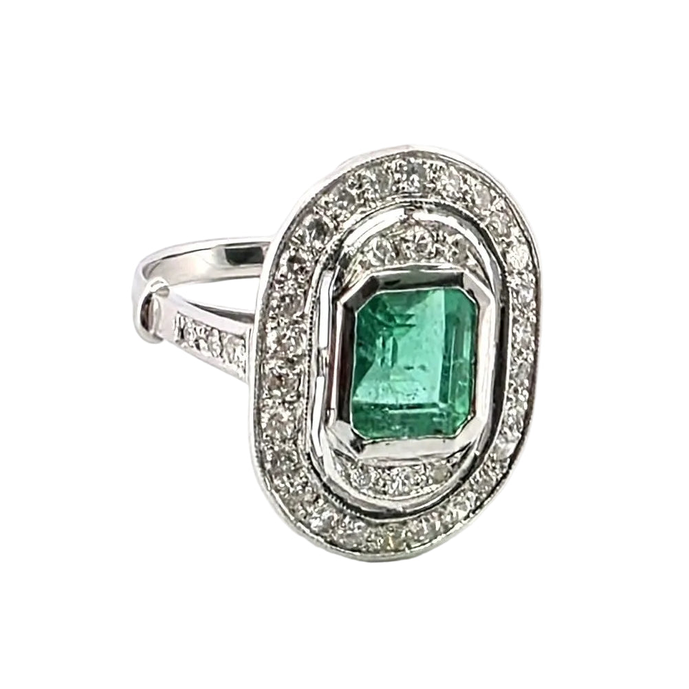 "Entourage" Ring in White Gold, Emerald, and Diamonds