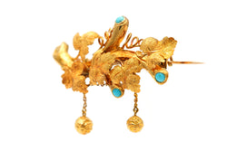 Broche Épingle en or jaune et turquoises