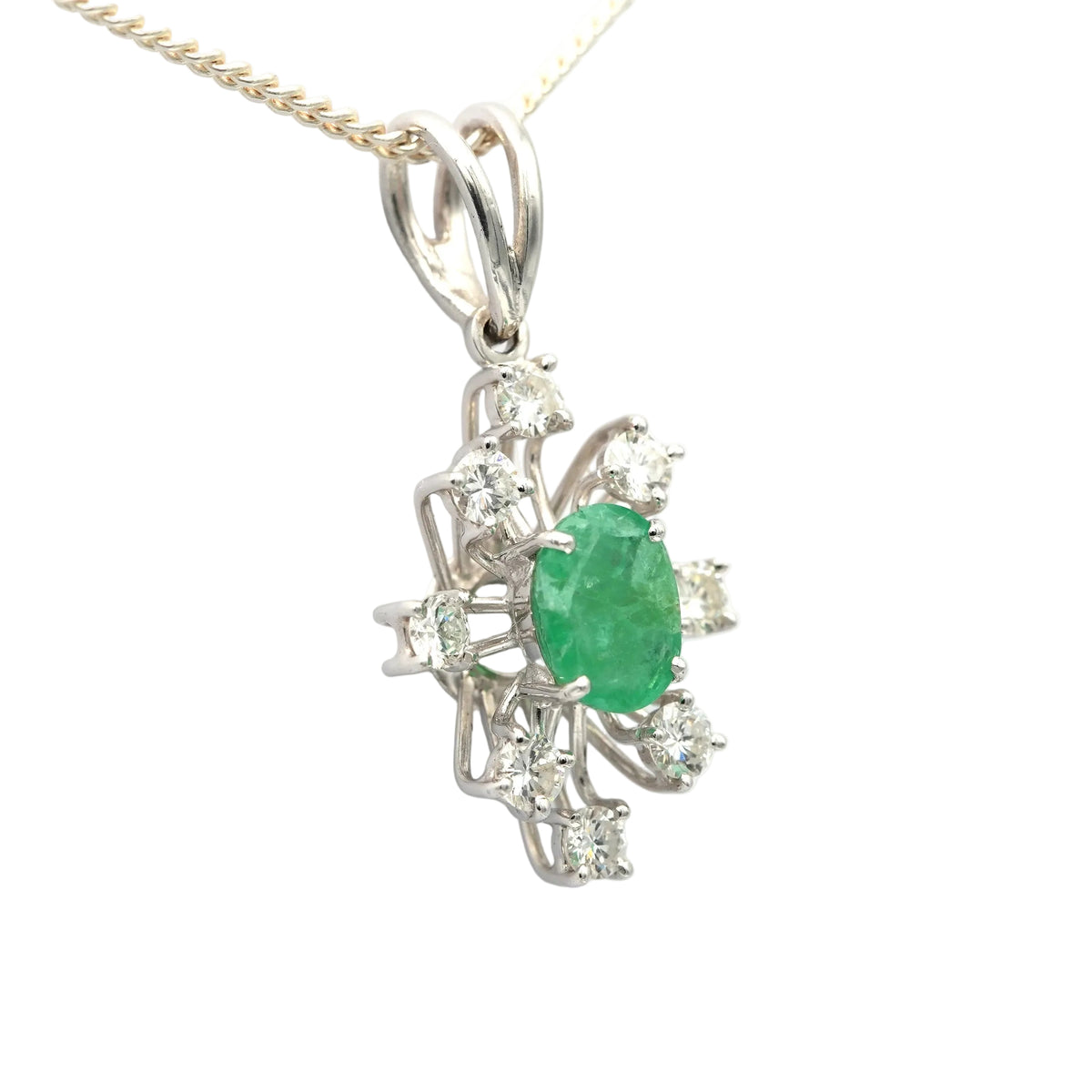 White gold pendant with emeralds and diamonds