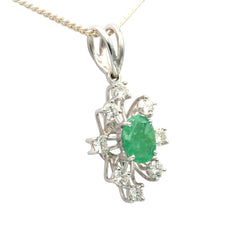 White gold pendant with emeralds and diamonds
