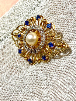 Gold brooch with sapphires, a pearl, and diamonds