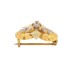 Brooch in white gold, yellow gold, green gold, and diamonds