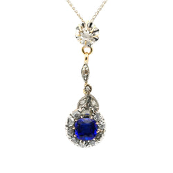 Necklace with a pendant made of yellow gold, silver, sapphire, and diamonds