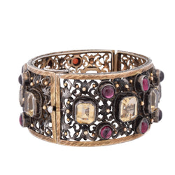 Cuff bracelet in yellow gold, silver, beryls, and garnets