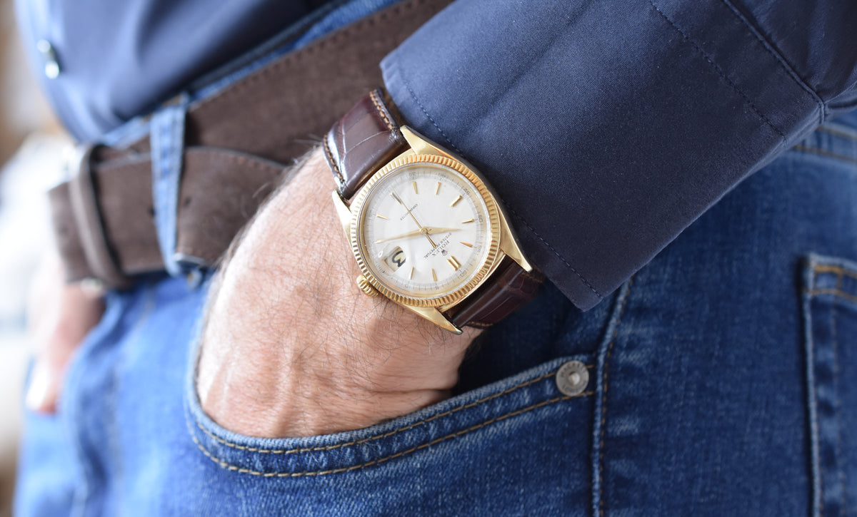 ROLEX "Oyster Perpetual Date Ovettone" watch in yellow gold and leather