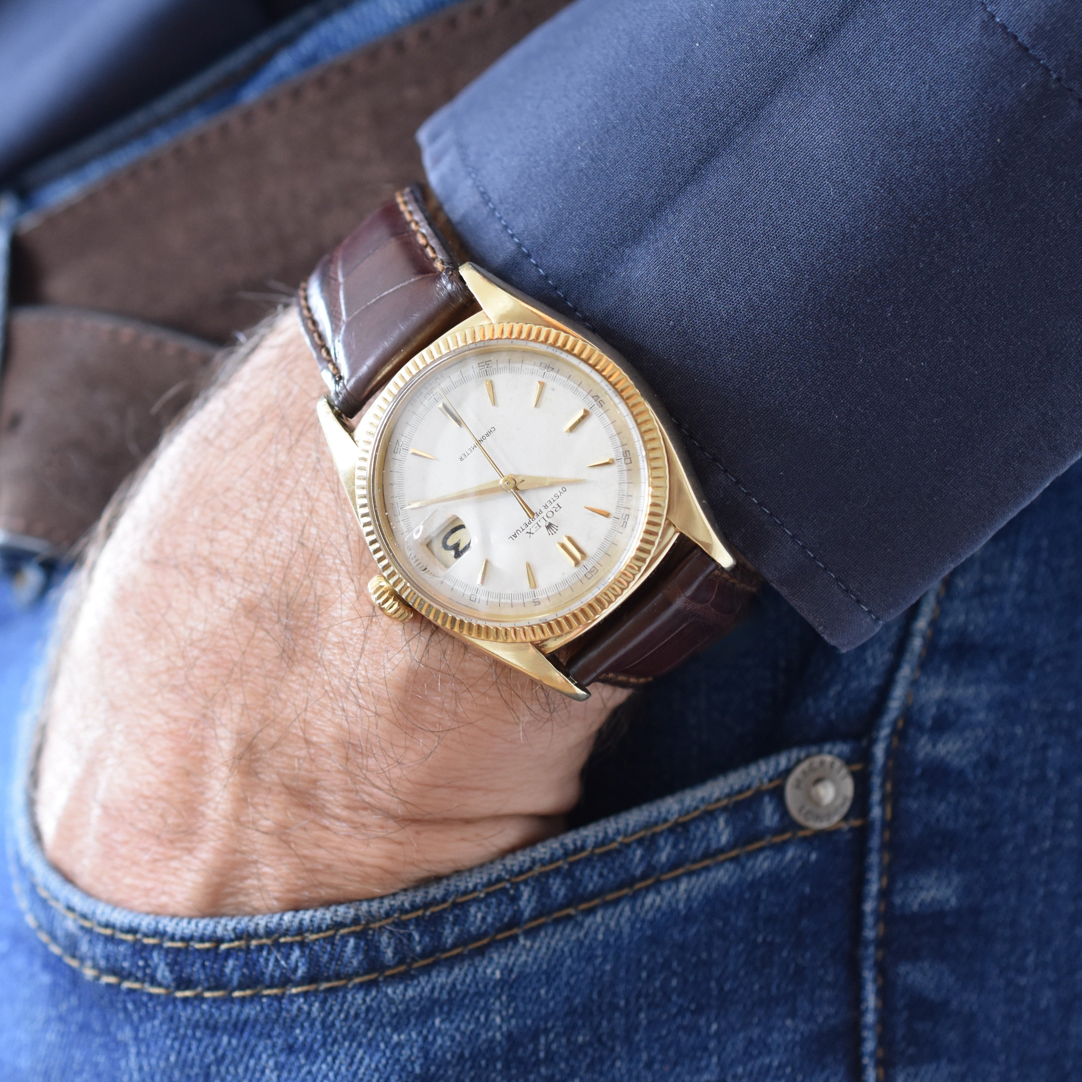 ROLEX "Oyster Perpetual Date Ovettone" watch in yellow gold and leather