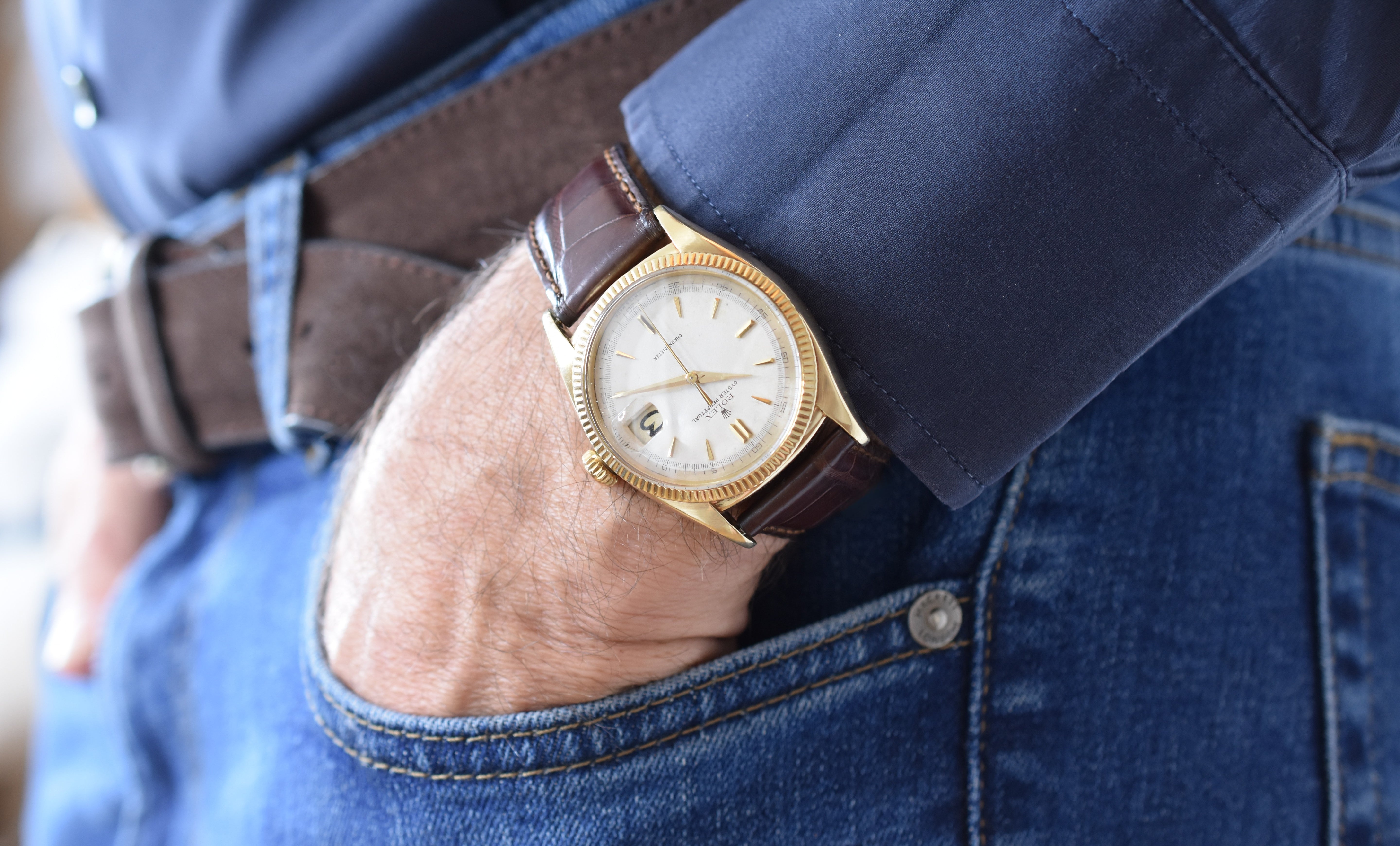 ROLEX "Oyster Perpetual Date Ovettone" watch in yellow gold and leather