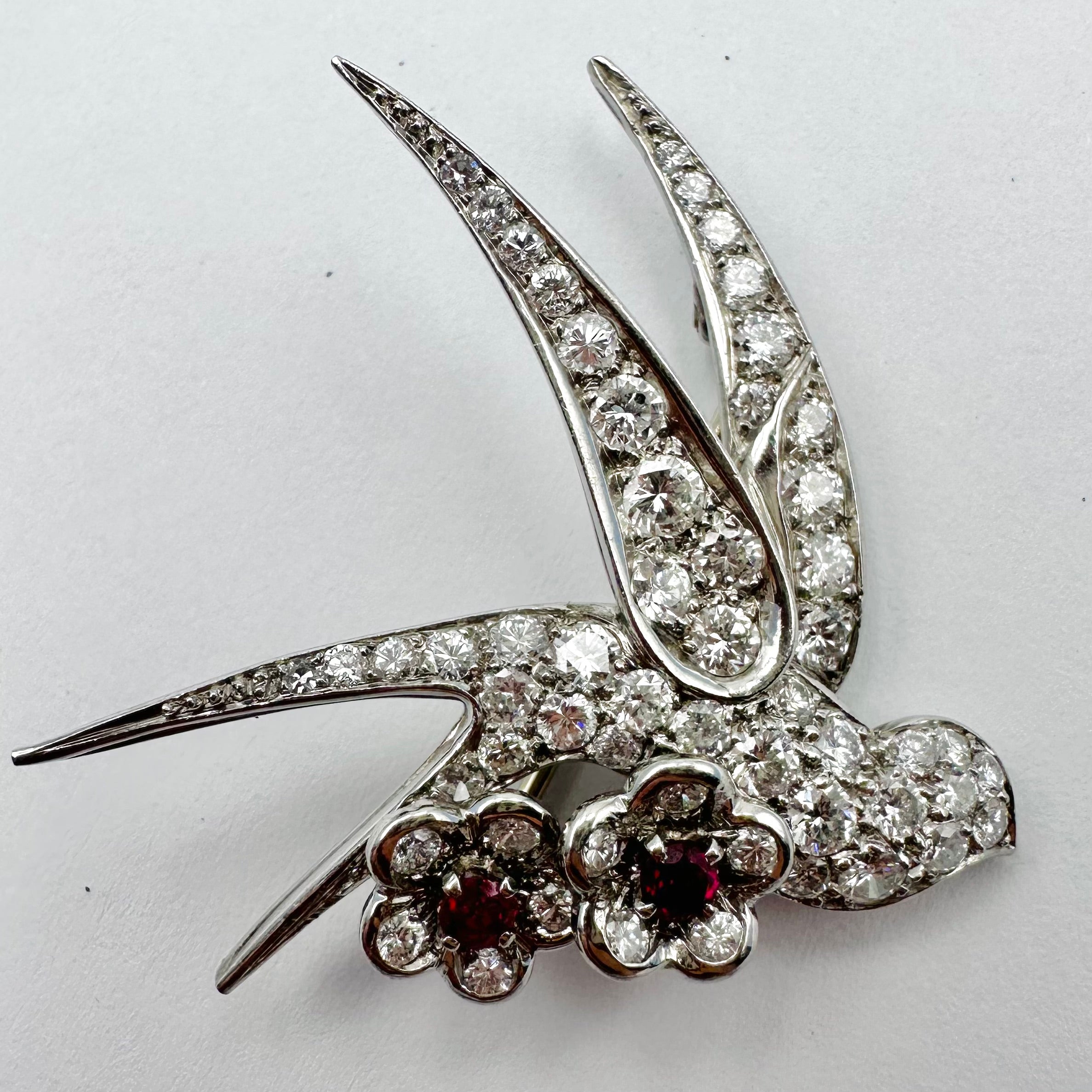 Brooch "Bird on two flowers" in white gold and Platinum