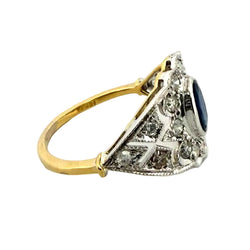 Entourage Ring in white gold, yellow gold, sapphire, and diamonds
