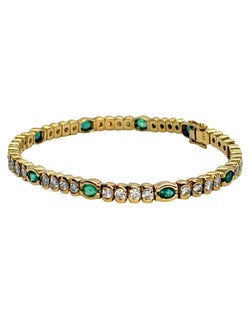 "Ligne" Bracelet in Yellow Gold, Emeralds, and Diamonds