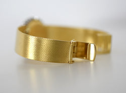 CHOPARD watch, Ref. 810, 18-carat yellow gold and diamonds, solid gold integrated bracelet, circa 1980.