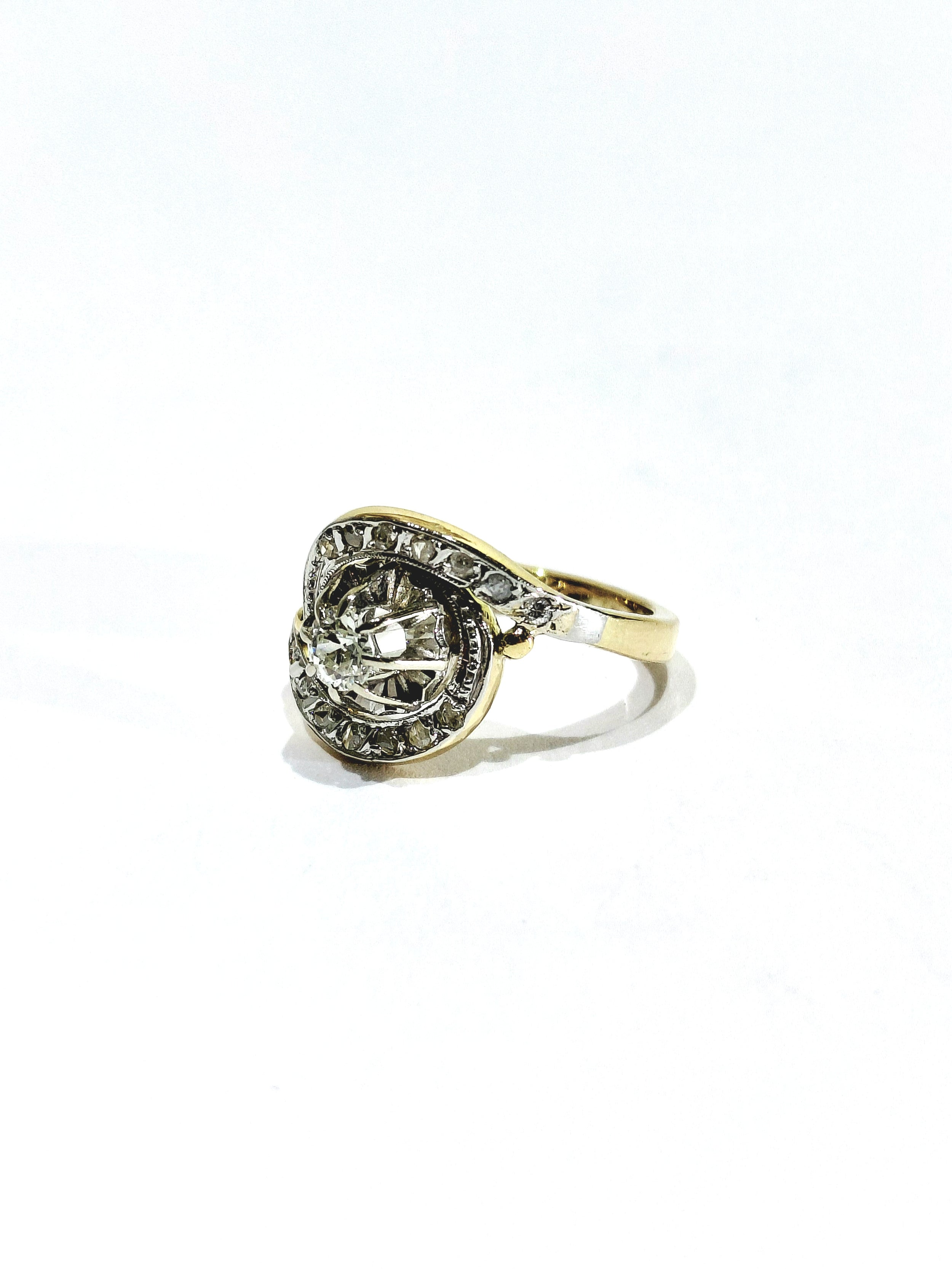 Tourbillon ring in yellow gold, white gold, and diamonds