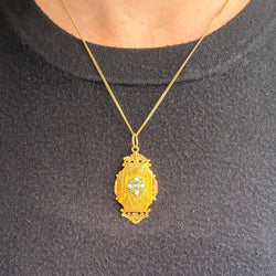 Yellow gold locket with pearls and emeralds