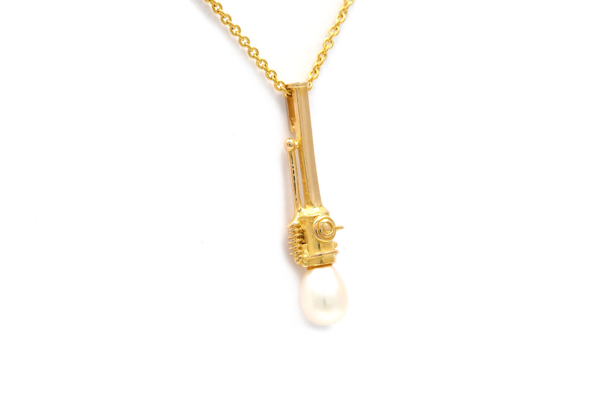 Pendentif en or jaune et perle