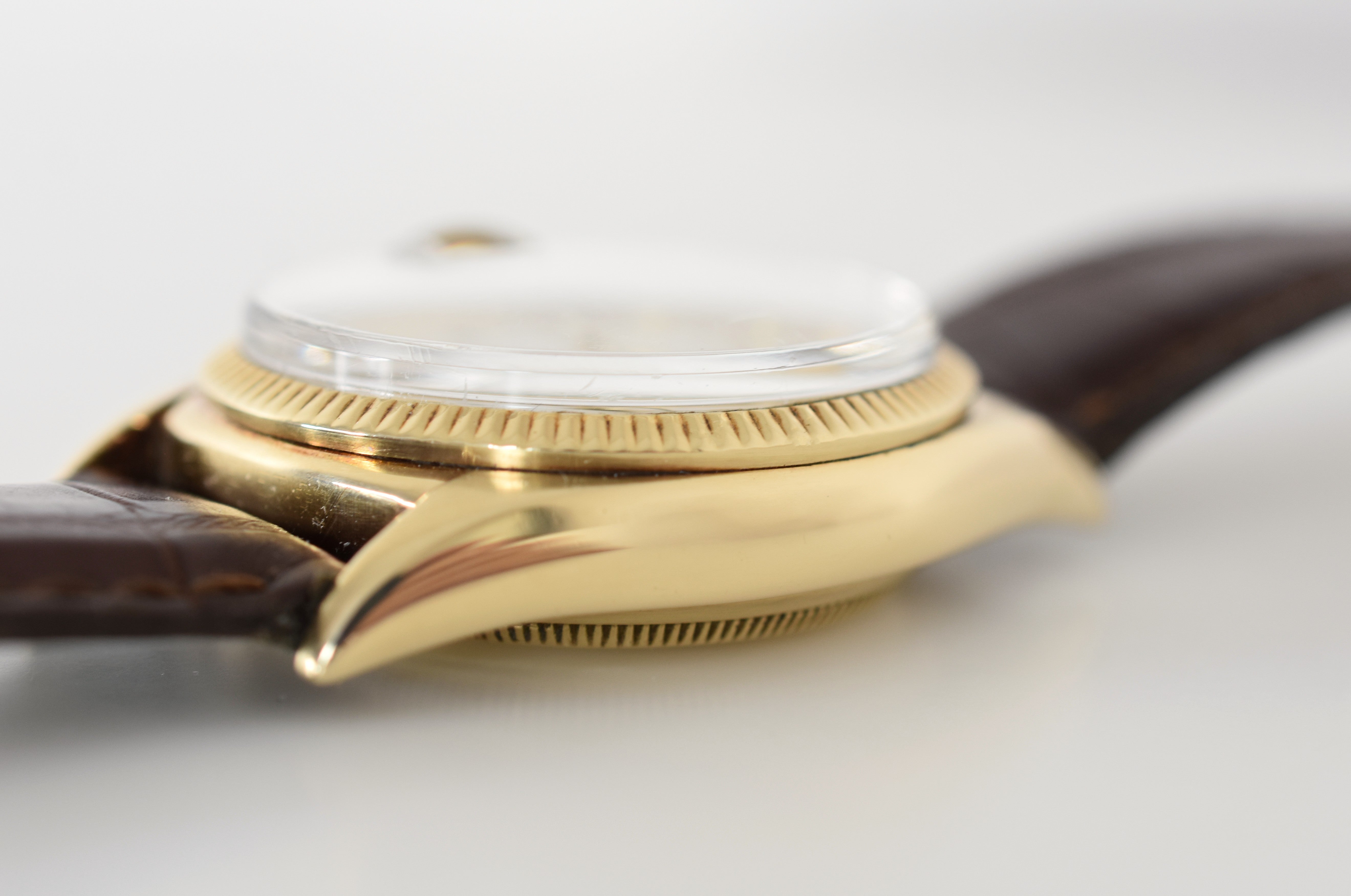 ROLEX "Oyster Perpetual Date Ovettone" watch in yellow gold and leather