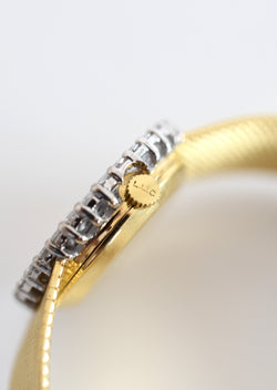 CHOPARD watch, Ref. 810, 18-carat yellow gold and diamonds, solid gold integrated bracelet, circa 1980.