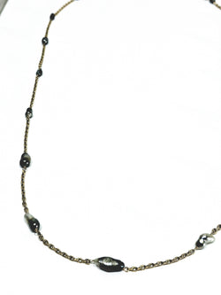 Rose gold long necklace with Tahitian pearls.