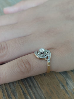 Tourbillon ring in yellow gold, white gold, and diamonds