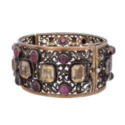 Cuff bracelet in yellow gold, silver, beryls, and garnets