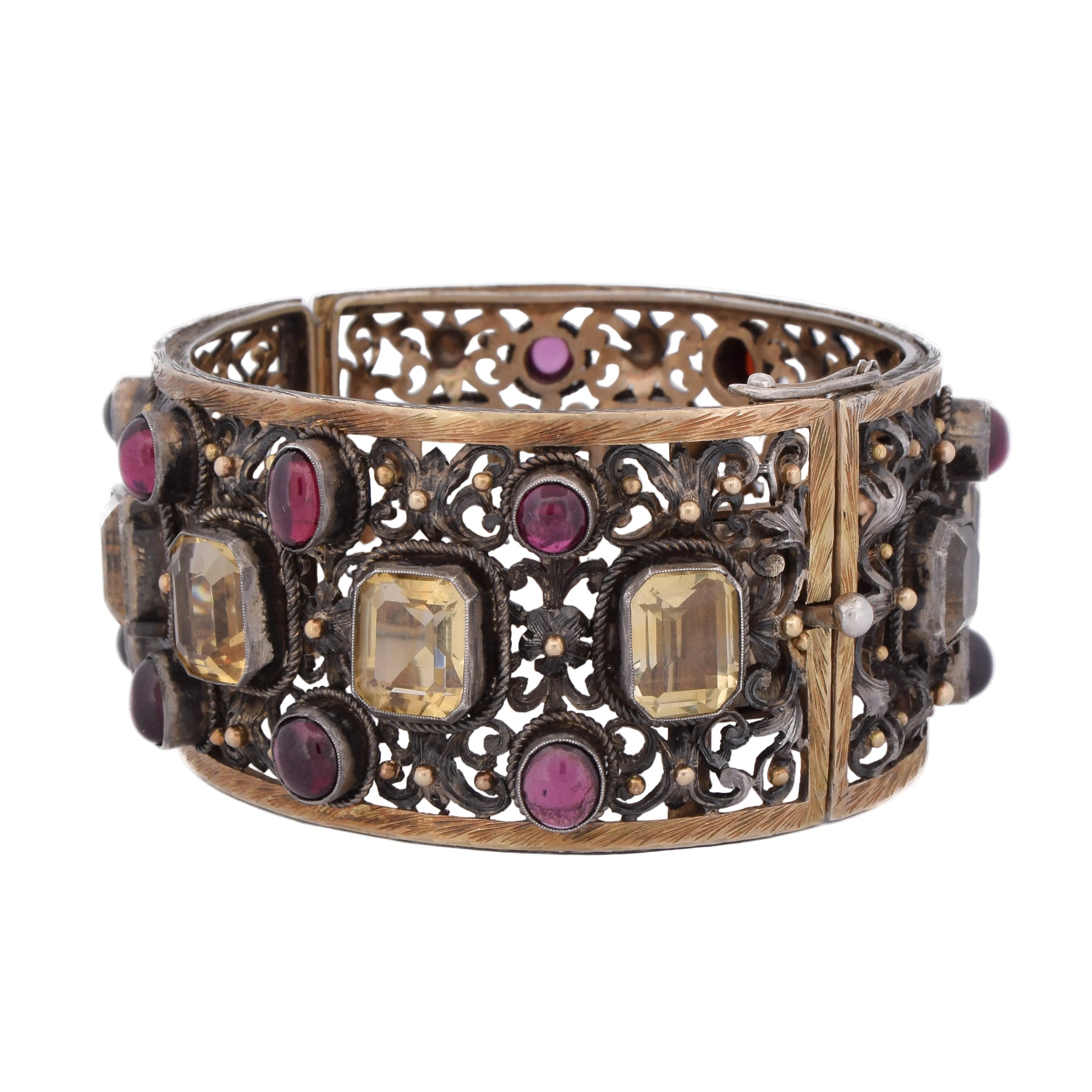 Cuff bracelet in yellow gold, silver, beryls, and garnets