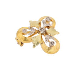 Brooch in white gold, yellow gold, green gold, and diamonds