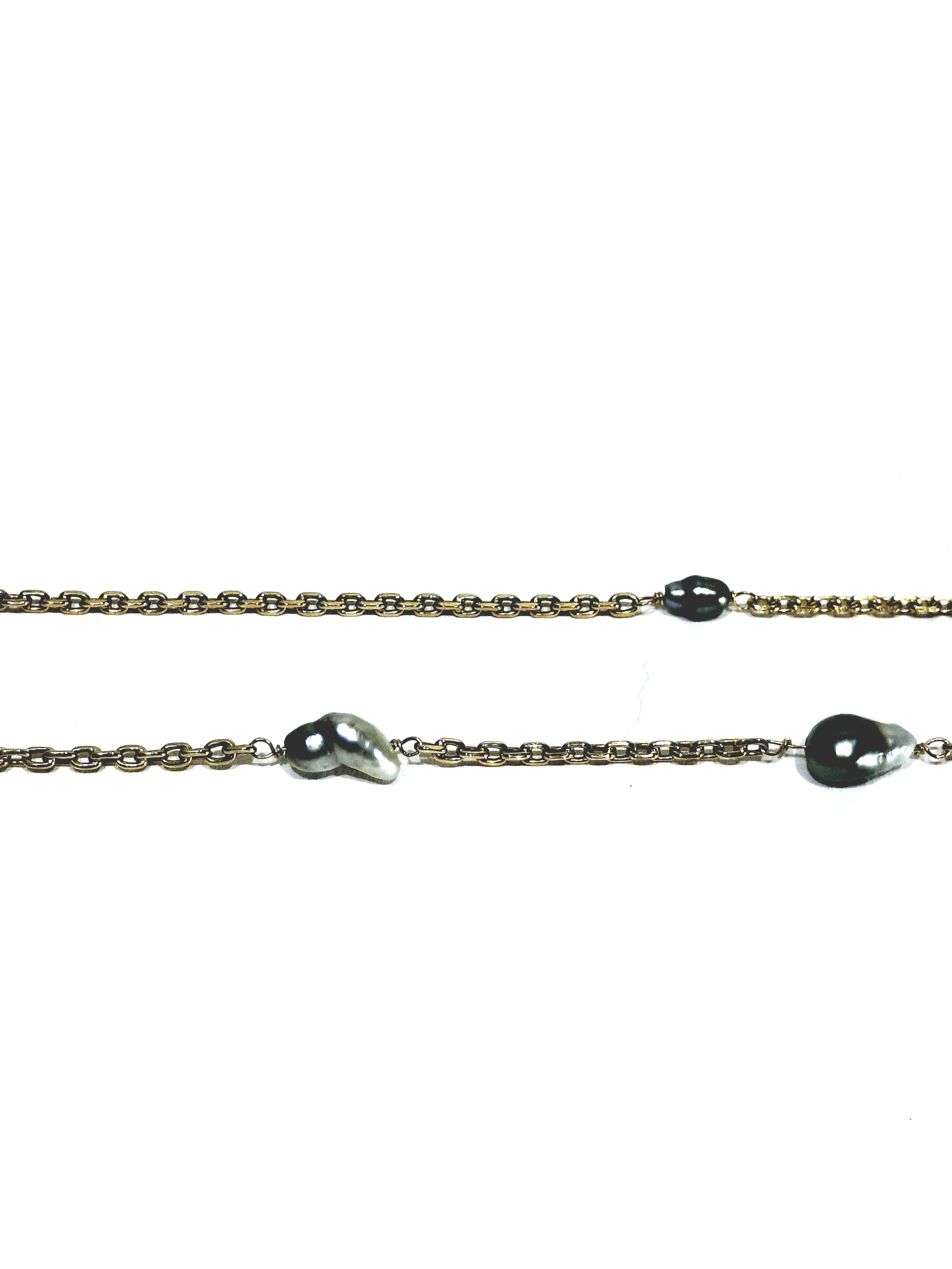 Rose gold long necklace with Tahitian pearls.