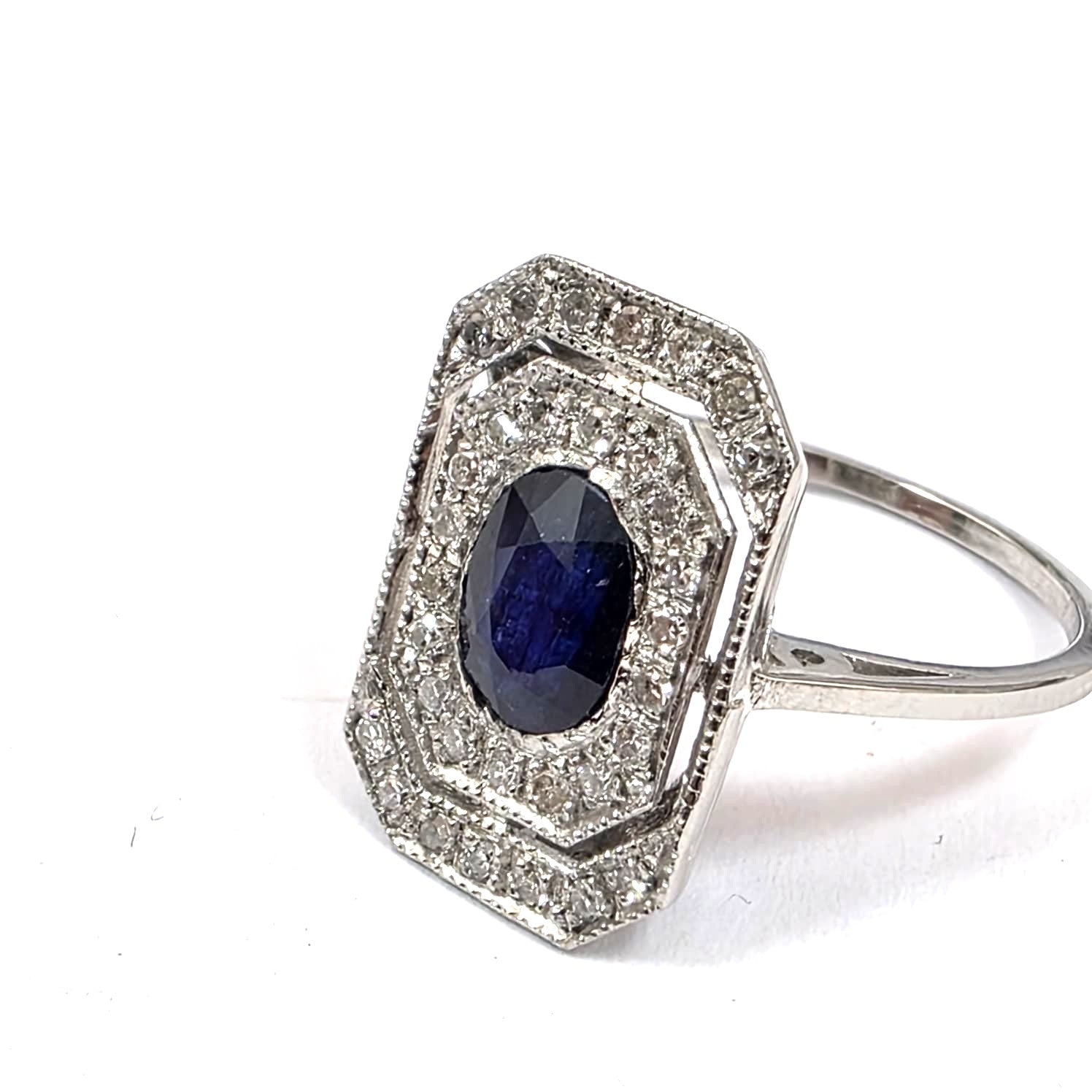 "Entourage" Ring in White Gold, Sapphire, and Diamonds