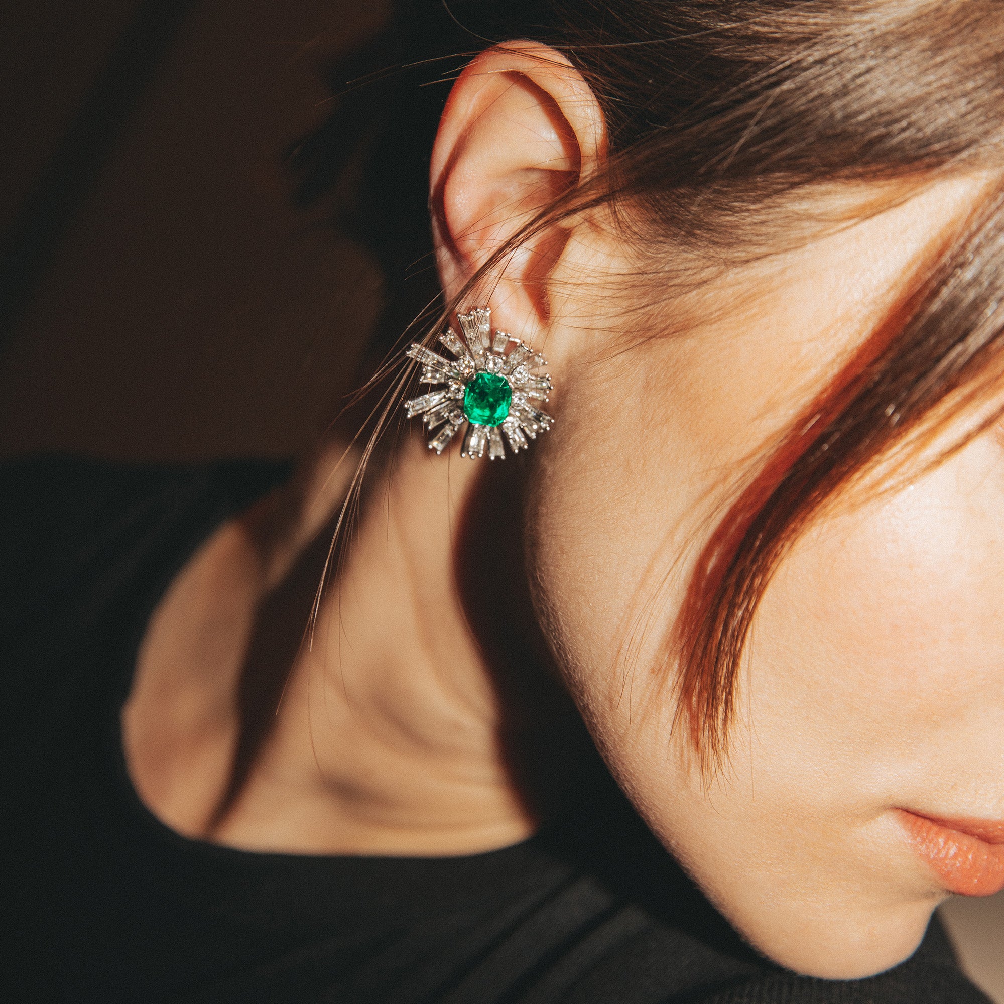 Clip-on earrings in white gold, platinum, Colombian emeralds, and diamonds