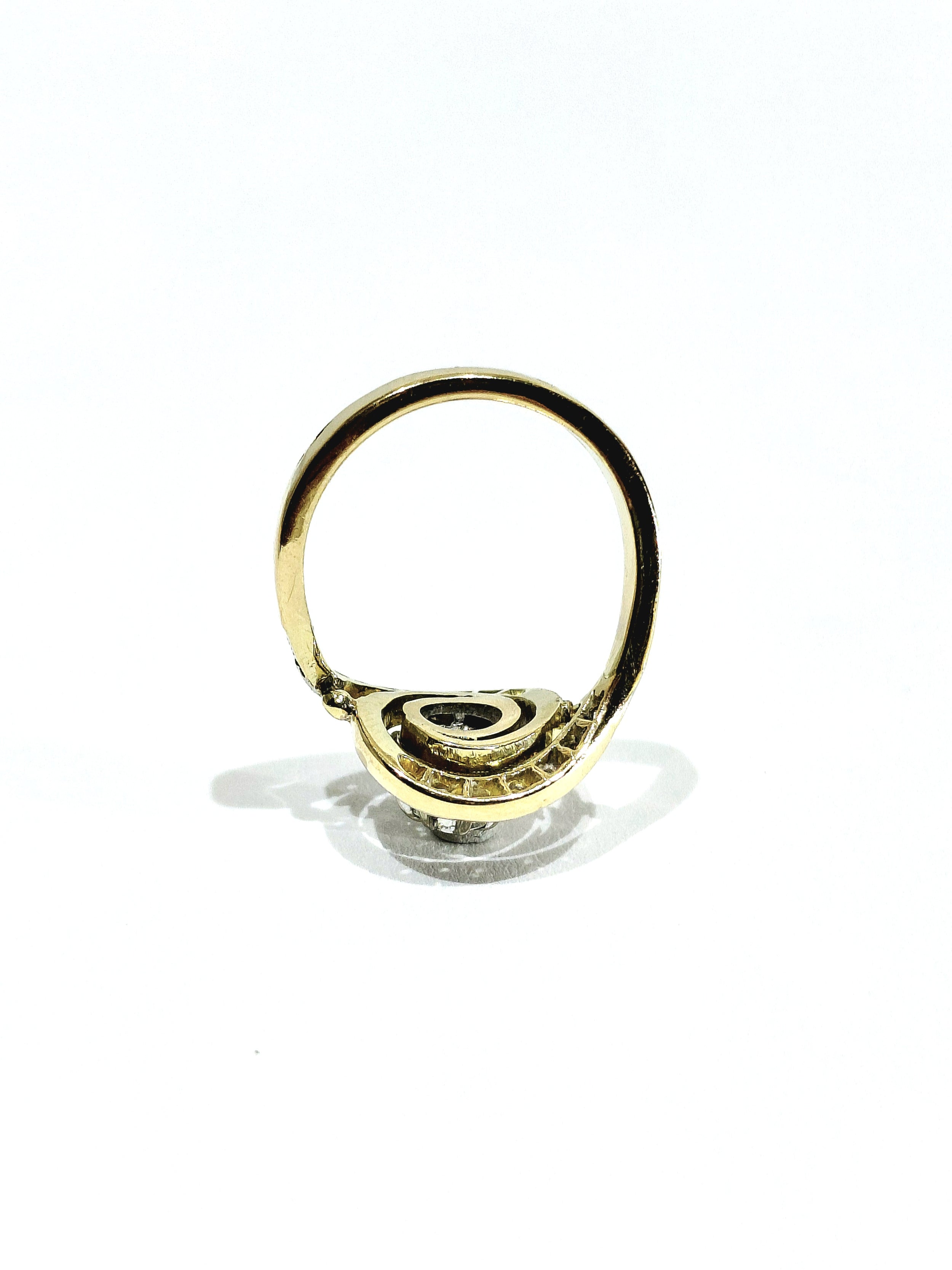 Tourbillon ring in yellow gold, white gold, and diamonds