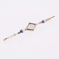 Brooch made of yellow gold, platinum, sapphires, and diamonds