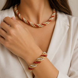 Set of jewelry in yellow gold, coral, and pearls