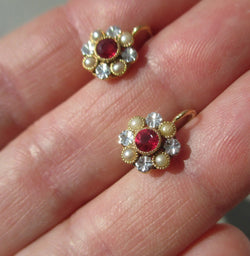 Lever-back earrings in yellow gold, white gold, rubies, and pearls