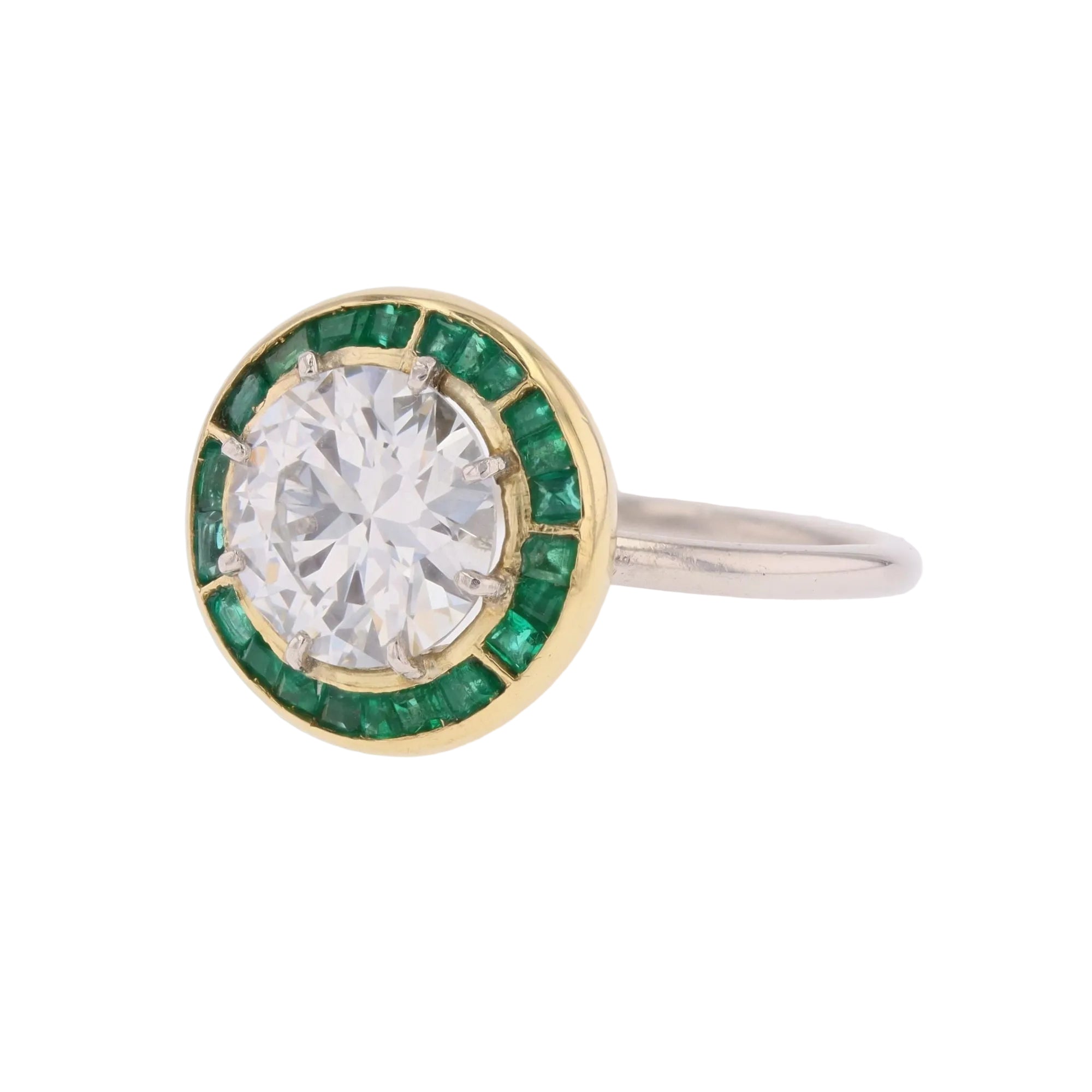 Entourage Ring in white gold, yellow gold, emeralds, and diamonds