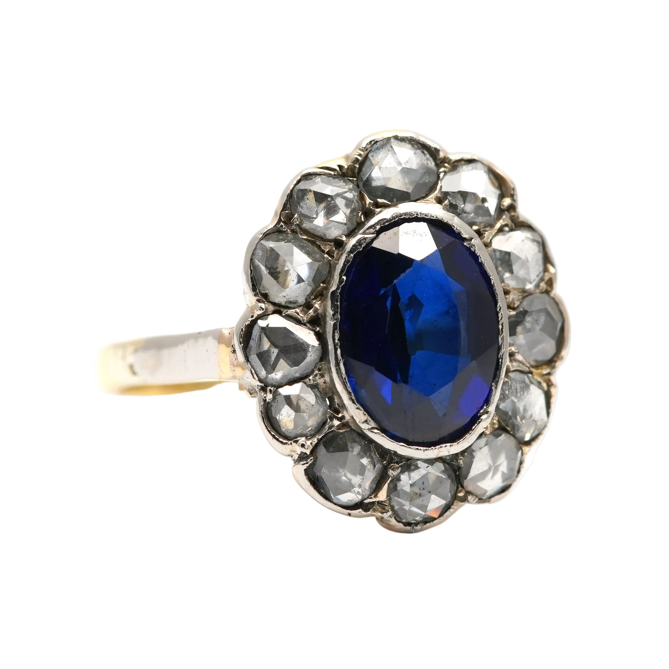 Entourage Ring in white gold, yellow gold, sapphire, and diamonds
