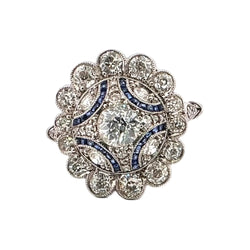 Entourage Ring in platinum, sapphires, and diamonds