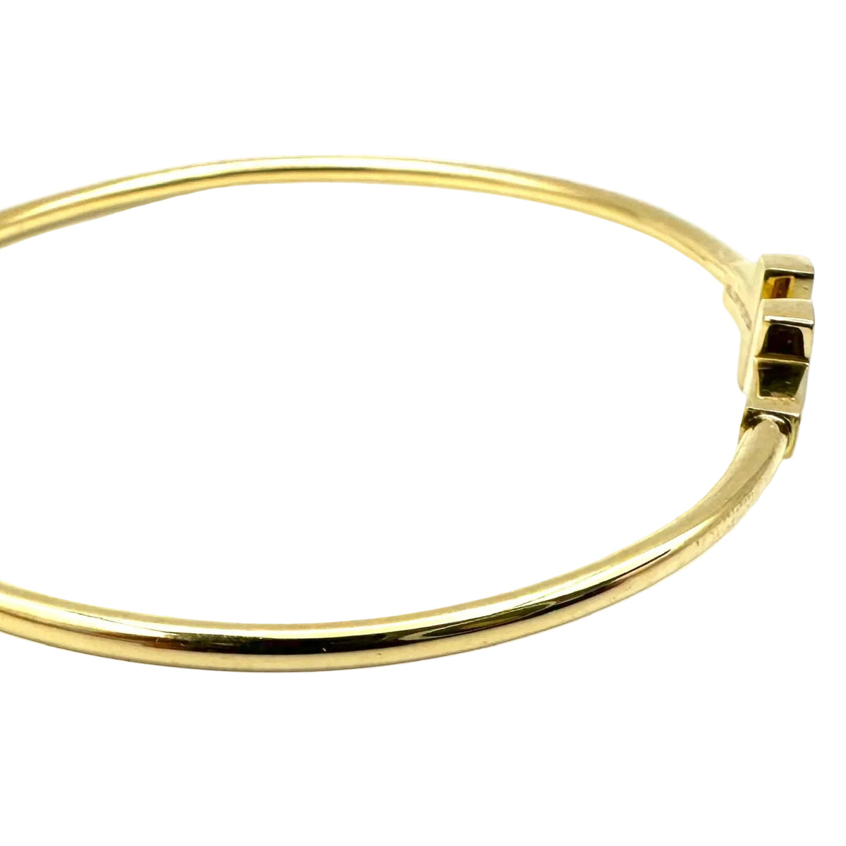TIFFANY & CO. "Tiffany T" Yellow Gold Bangle