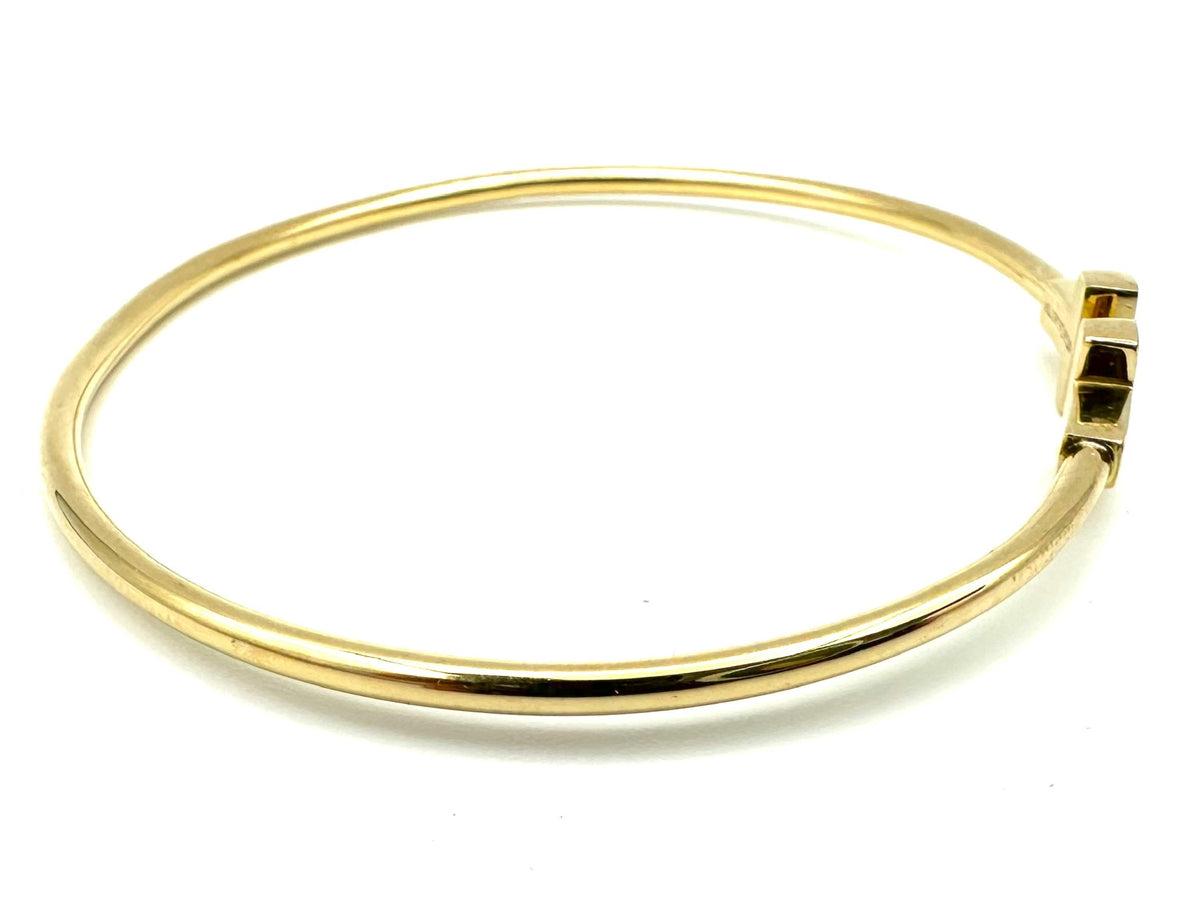TIFFANY & CO. "Tiffany T" Yellow Gold Bangle Bracelet