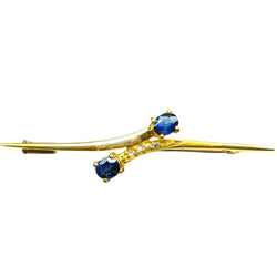 Cross-shaped brooch in yellow gold, sapphires, and diamonds, circa 1960