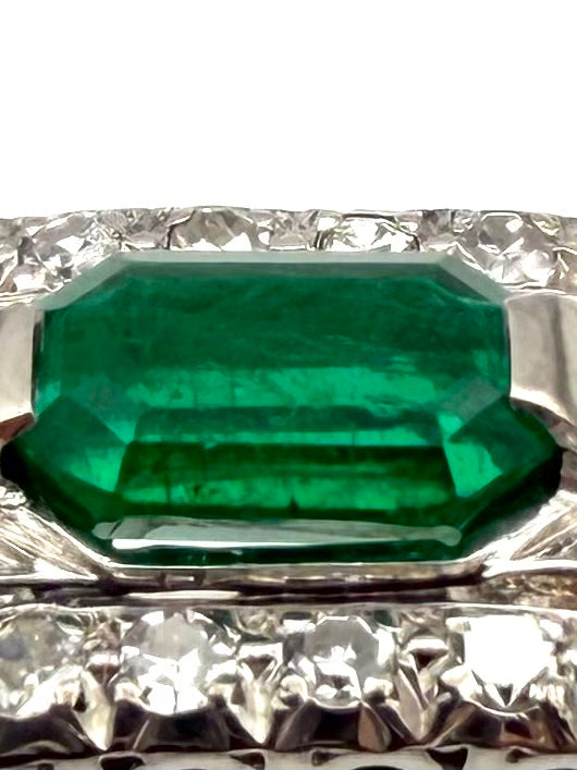 Art Deco ring in gold, platinum, emerald, and diamonds