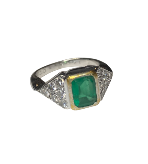 Ring in white gold, yellow gold, emerald, and diamonds