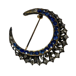 Brooch made of yellow gold, silver, sapphires, and diamonds